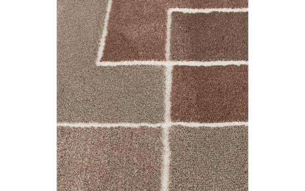 Transitional Atlas 5' x 7' Rust Geometric Rug with bold rust and orange geometric blocks, thick soft polypropylene pile for cozy, durable flooring.