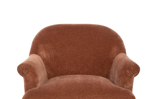 Brown upholstered armchair with rounded backrest and plush cushioned seat, featuring soft fabric and rolled armrests for comfortable seating.