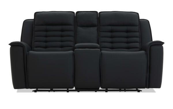 Black leather reclining loveseat with padded armrests, segmented cushioned backrests, and a center console, ideal for home theater seating.