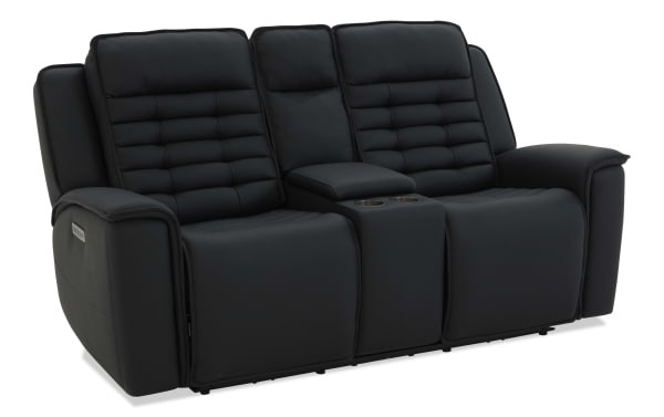 Black leather reclining loveseat with padded armrests, tufted back cushions, and center console with cup holders, ideal for home theater seating.
