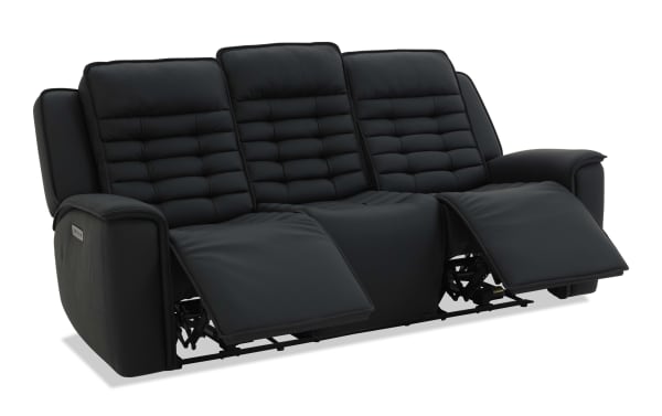 Black leather three-seat reclining sofa with padded backrests and armrests, featuring two extended footrests for enhanced comfort.