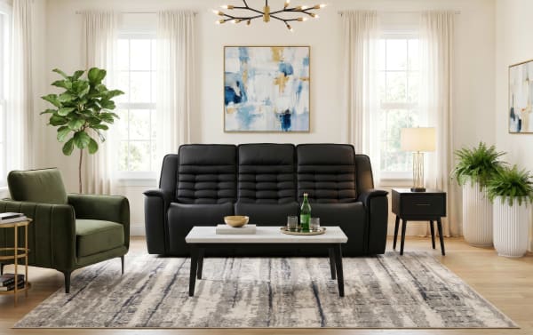 Raptor Black Leather 87'' Power Reclining Sofa with Power Headrest in sleek black leather, contemporary style, with plush Bob-O-Pedic® memory foam cushioning, USB/USB-C ports, wireless charging, cup holders, and drop-down table.