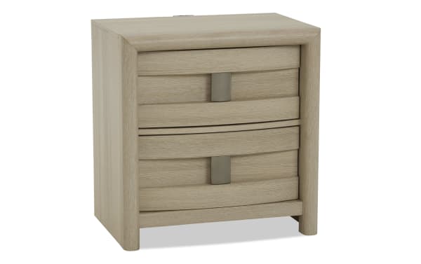 Light wood nightstand with two curved front drawers, matte metal handles, and rounded edges, suitable for bedroom storage.