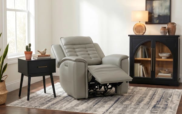 Contemporary Raptor Gray Power Recliner with power headrest and lumbar support, upholstered in soft gray leather with memory foam cushioning and USB ports.