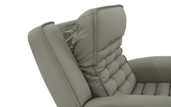 Close-up of a taupe gray leather recliner chair backrest with padded, tufted cushioning and adjustable headrest for ergonomic comfort.