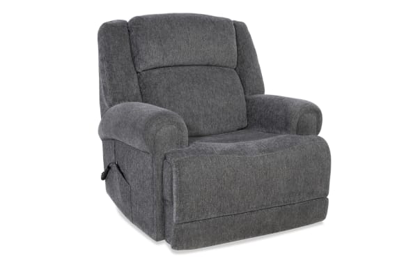 Gray fabric upholstered recliner chair with padded armrests and cushioned backrest, featuring a side lever for reclining adjustment.