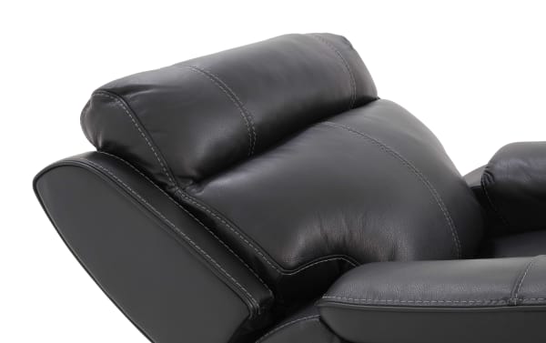 Black leather recliner chair headrest and armrest with detailed stitching, showcasing soft padded upholstery and modern design.