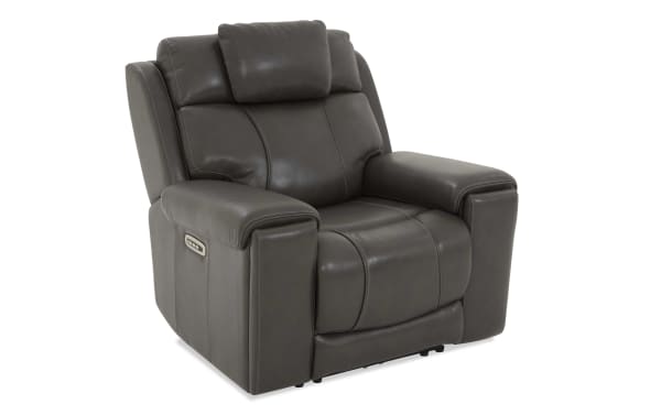 Dark gray leather recliner chair with padded armrests, cushioned backrest, and built-in side control panel for reclining adjustment.