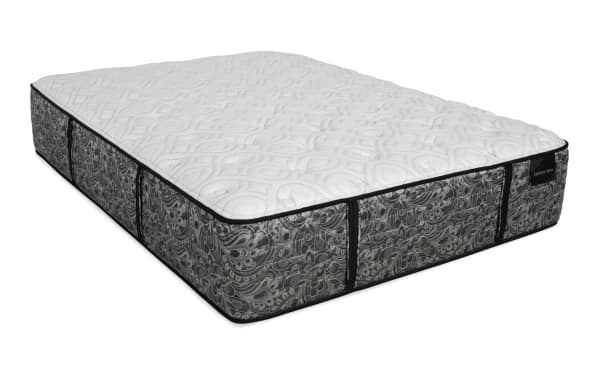 Mattress with a white quilted top and gray patterned sides, featuring black piping and corner handles, labeled "DISTINCTION."