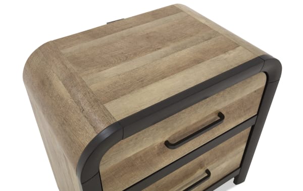 Wooden nightstand with light brown natural wood grain finish, rounded black metal frame edges, and two drawers with black handles.