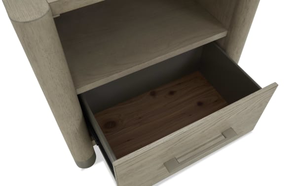 Light wood drawer with metal handle, partially open, showing dark wood interior and smooth finish, part of a modern storage unit.