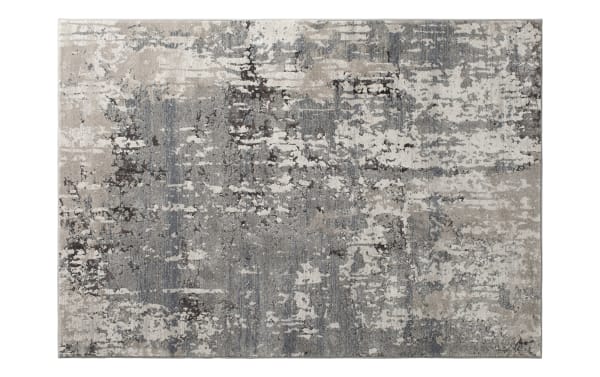 Contemporary area rug with an abstract distressed pattern in shades of gray, beige, and cream, featuring a soft, textured surface suitable for modern living spaces.