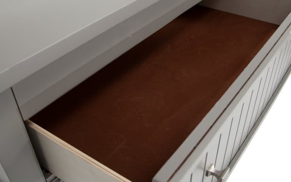 Open drawer of the Spencer Gray 5 Drawer Lift-Top Chest showing smooth brown felt lining, part of the transitional Spencer collection with hardwood and poplar solids.