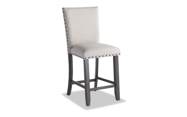 Sonoma Espresso & Beige Solid Back Upholstered Counter Height Stool with beige polyester fabric, espresso solid acacia frame, nailhead trim, and memory foam seat.