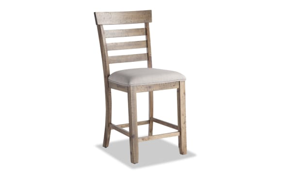Sonoma Natural & Beige Ladder Back Upholstered Counter Stool with solid acacia frame, beige polyester fabric seat, and memory foam cushion in rustic transitional style.