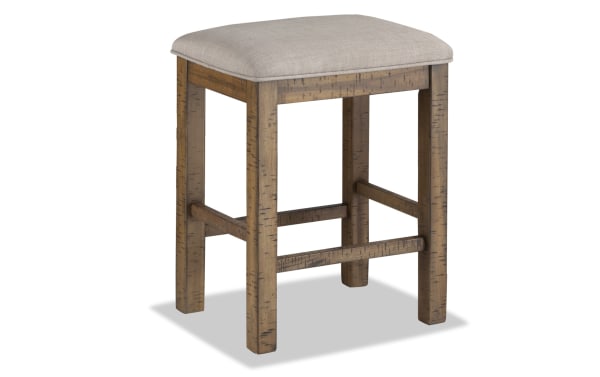 Rustic Sonoma Natural & Beige Backless Upholstered Counter Height Stool with solid acacia wood frame and beige polyester fabric seat.