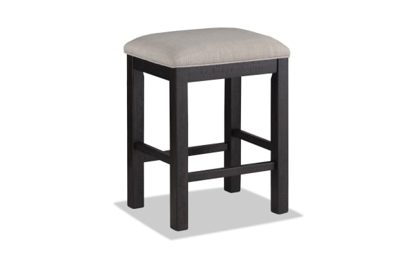 Sonoma Dining rustic backless counter stool with espresso solid acacia frame and beige polyester fabric seat with memory foam upholstery.