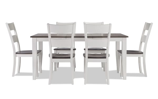 Blake 7 Piece White & Gray Extendable Dining Set with six white cottage-style chairs and a gray wood top table featuring an 18" leaf, made from MDF, birch veneers, hardwood solids, mango veneers, and rubberwood solids.