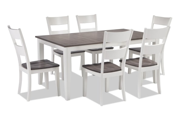 Blake 7 Piece White & Gray Extendable Dining Set with six white cottage-style chairs, gray wood seats, and a sturdy MDF and hardwood table with 18" leaf.