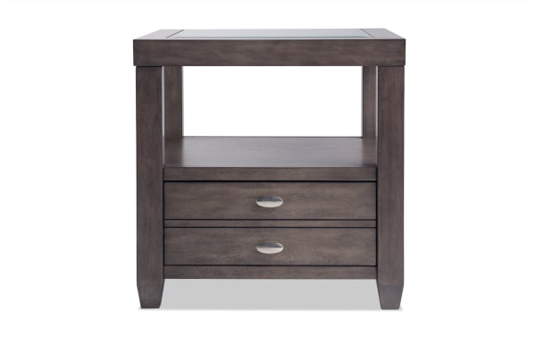 Transitional Prestige Gray Storage End Table with tempered glass top, solid acacia wood, MDF, platinum finish, oval metal handles, drawer, and display shelf.