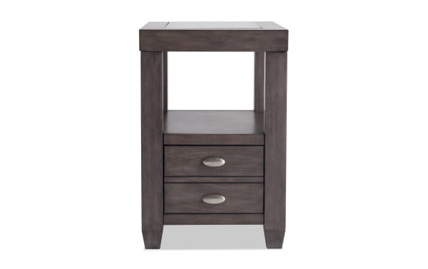 Prestige Gray Storage Chairside Table from Prestige Occasional collection, transitional style with solid acacia, MDF, glass top, beveled edge, two drawers, metal handles, open shelf, and built-in USB ports.