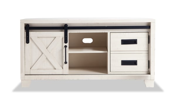 Montana 48'' white rustic TV stand with sliding barn door, pine solids, MDF, pine veneer, open shelves, and two drawers for media storage.