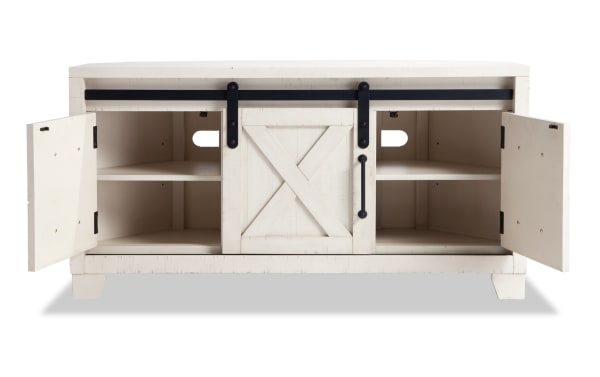 Montana 48'' white rustic TV stand with sliding barn door, pine solids, MDF, pine veneer, open shelves, and storage cabinets.