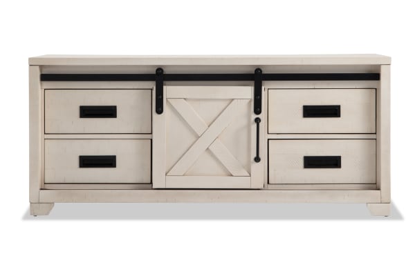 Montana 55'' white rustic TV stand with pine solids, MDF, and veneer, featuring sliding barn door, four drawers, and ample media storage.