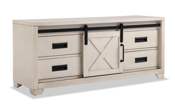 Montana 55'' white rustic TV stand with pine solids, MDF, and pine veneer, featuring sliding barn door, black handles, and multiple storage drawers.