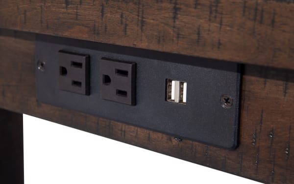 Black power outlet panel with two standard electrical sockets and two USB charging ports, mounted on rustic brown acacia veneer wood from the Montana 4 Piece Espresso & Beige Upholstered Sofa Table Set, featuring transitional style and beige polyester upholstery.
