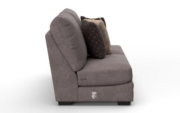 Modern gray fabric sofa side view with textured upholstery, dark wooden legs, and three decorative patterned cushions.