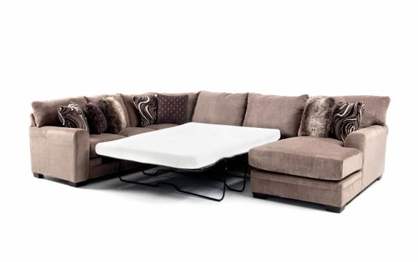 Luxe Gray 150'' 4-piece right arm facing transitional sleeper chaise sectional in gray polyester fabric with gel memory foam queen mattress and patterned accent pillows.