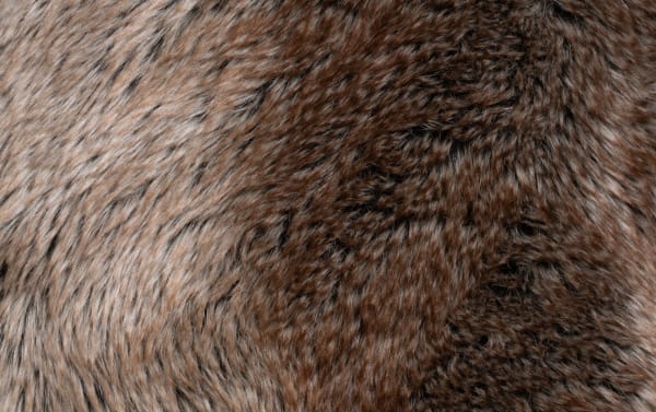 Close-up of soft, brown and gray chenille-like polyester fabric with a plush, textured fur pattern, highlighting Luxe Gray 3 Piece Sectional upholstery.