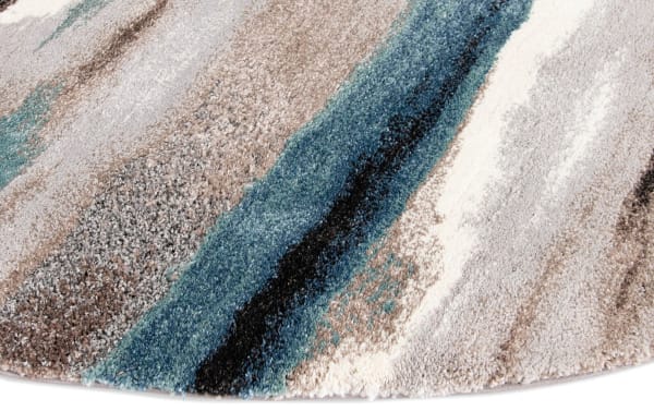 Round Spa Tones 8' multi striped rug with plush polyester fabric in blue, beige, black, and cream tones, perfect for transitional decor.