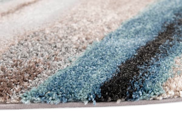 Close-up of Spa Tones 8' Round Multi Striped Rug showing plush polyester fabric in multicolored transitional stripes with blue, beige, and black hues.
