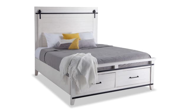 Montana Queen White Storage Platform Bed in rustic pine solids and veneer with built-in footboard drawers, black metal accents, and a high headboard.
