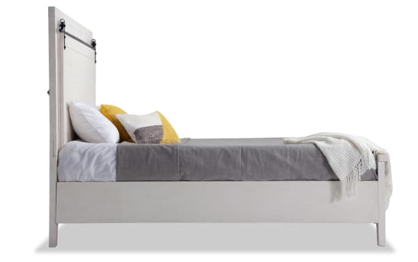 Montana Queen White Storage Platform Bed in rustic pine solids and veneer, featuring a high headboard and low footboard with gray bedding and accent pillows.