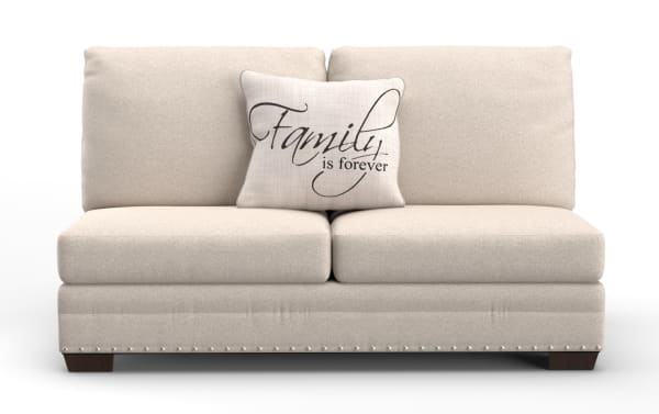 Beige fabric loveseat sofa with dark wooden legs, featuring a decorative beige throw pillow with the text "Family is forever" in elegant black script.