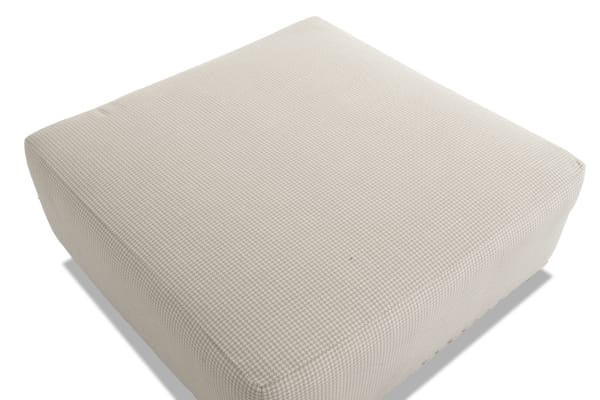 Beige Cottage Chic ottoman with traditional style, polyester fabric upholstery, subtle gingham pattern, and nailhead trim accents.