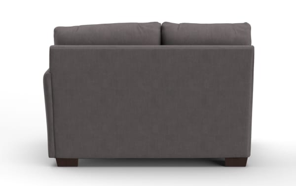 Dark gray fabric sofa viewed from the back, featuring clean lines, plush cushions, and wooden block legs, suitable for modern living rooms.