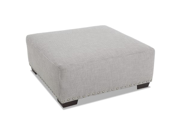 Cottage Chic Gray Ottoman with traditional style, gray polyester fabric upholstery, nailhead trim, and memory foam cushion for comfortable seating.