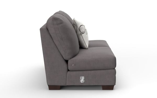 Modern gray fabric sofa with plush back cushions and a white decorative pillow, featuring wooden legs and a metal latch on the side.