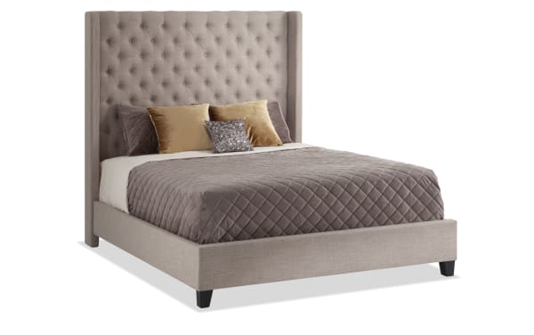 Emerson King Beige Upholstered Panel Bed in taupe polyester fabric with button-tufted high wingback headboard and low-profile footboard, transitional style.
