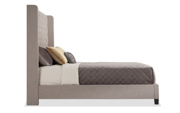Emerson King Beige Upholstered Panel Bed in taupe polyester fabric with button-tufted wingback headboard, low footboard, and side rails, transitional style.