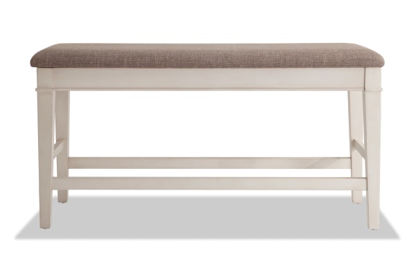 Montana White & Beige Upholstered Counter Height Storage Dining Bench with rustic white rubberwood frame, beige polyester fabric seat, and hidden storage.