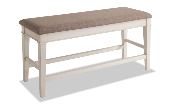 Montana White & Beige Upholstered Counter Height Storage Dining Bench with rustic white rubberwood frame, beige polyester fabric top, and hidden storage.