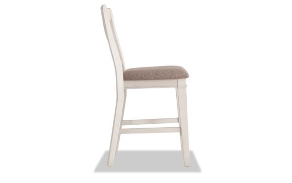 Montana White & Beige Slat Back Counter Height Stool with rustic white rubberwood frame, beige polyester fabric seat, and traditional slat back design.