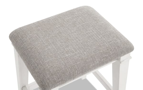 Beige fabric upholstered Montana White & Beige backless counter height stool with rustic rubberwood frame and memory foam seat cushion.
