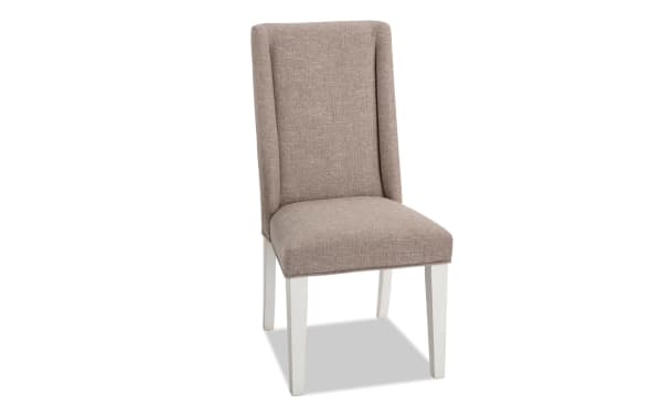 Montana White & Beige Solid Back Upholstered Dining Chair with beige polyester fabric, rubberwood legs, and memory foam seat in rustic style.