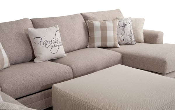Beige Cottage Chic 150'' 4-piece right arm facing chaise sectional with ottoman, traditional style, polyester fabric upholstery, includes decorative accent pillows with plaid and script designs.